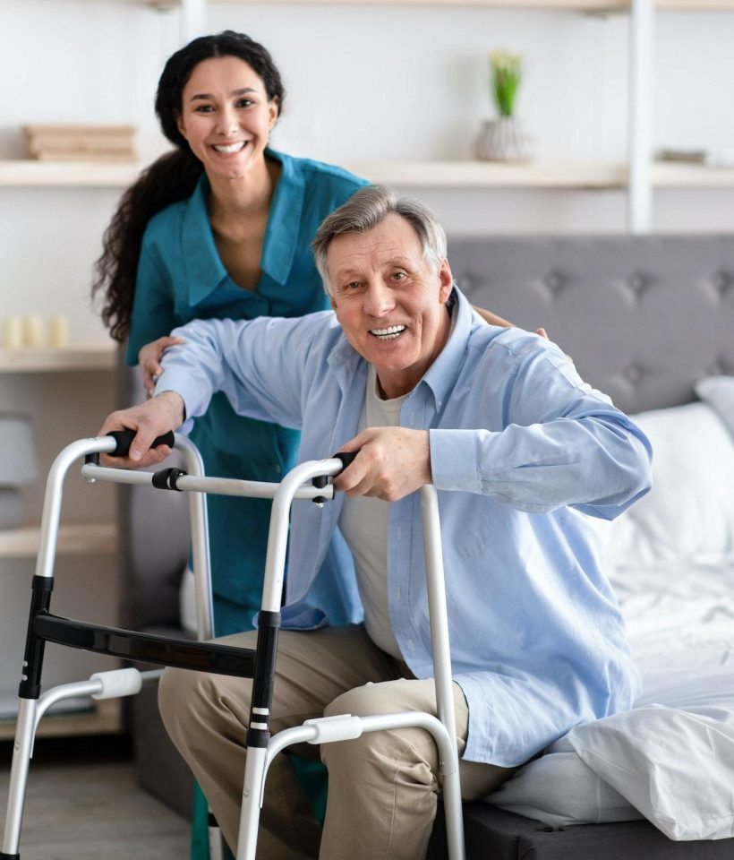 female-nurse-helping-elderly-male-with-walking-frame-stand-up-from-bed-at-home-professional-care.jpg female-nurse-helping-elderly-male-with-walking-frame-stand-up-from-bed-at-home-professional-care.jpg